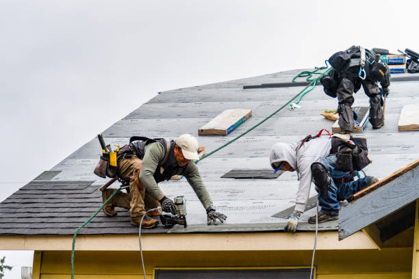 Professional Gutter Installation technician working in Milton, VT